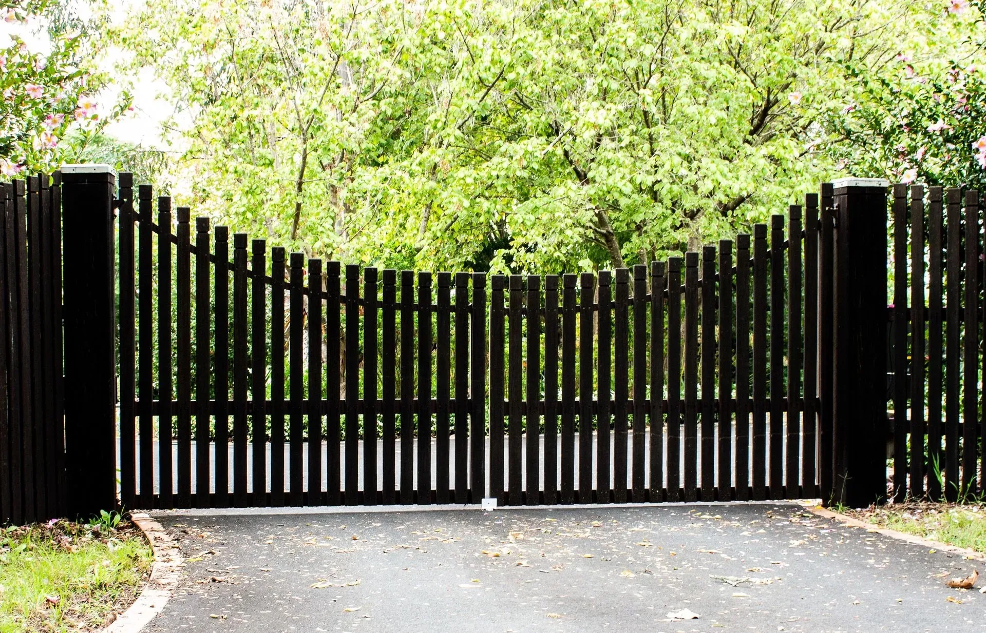 How Installing a Fence and Driveway Gate Keeps Your Home Secure